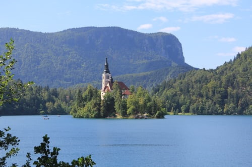 Lake Bled with a small island in the center, which can be reached by boat